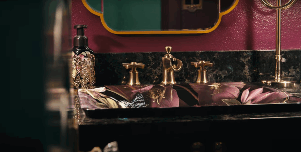 The room that I think was the nicest surprise was the powder room. We really ended up leaning in there with jewel tones and we really centered a lot of the room's design around the sink, ultimately. We found that sink several years before we actually started remodeling it and we knew we loved it and we just kind of worked from there. The powder room was that, oh yeah, we should also do that while we're here. And it turned out just this like amazing little showcase of what you can do with color and just lighting. Lighting, very dramatically. Lighting.