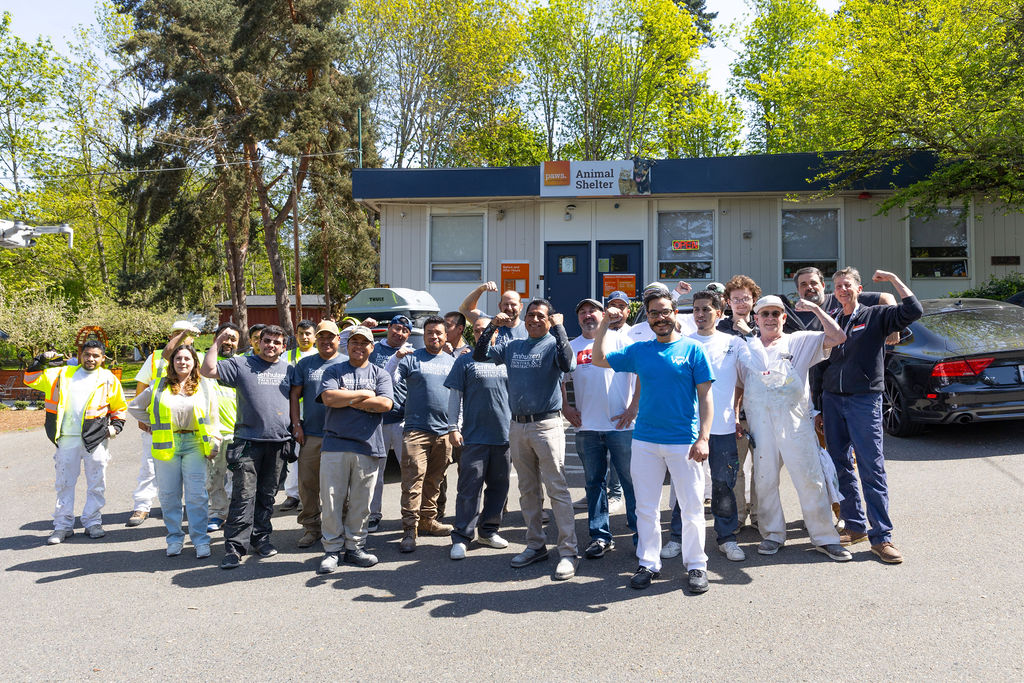 Tenhulzen Construction along with volunteers from Rotary, WSCPCA and other local painting firms celebrate a successful day renovating the PAWS facility