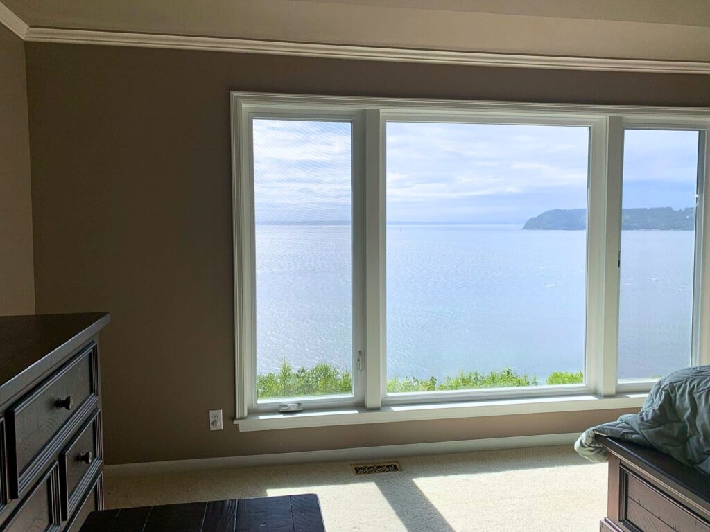 Clean interior paint finish with crisp white window trim and crown molding in a Pacific Northwest home